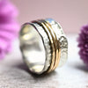 Drehring Silber trifft Gold "Yaffa" mit drei Außenringen